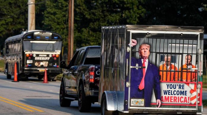 Dozens of Trump supporters cheer him on as former president turns himself in at Georgia jail – Daily Press